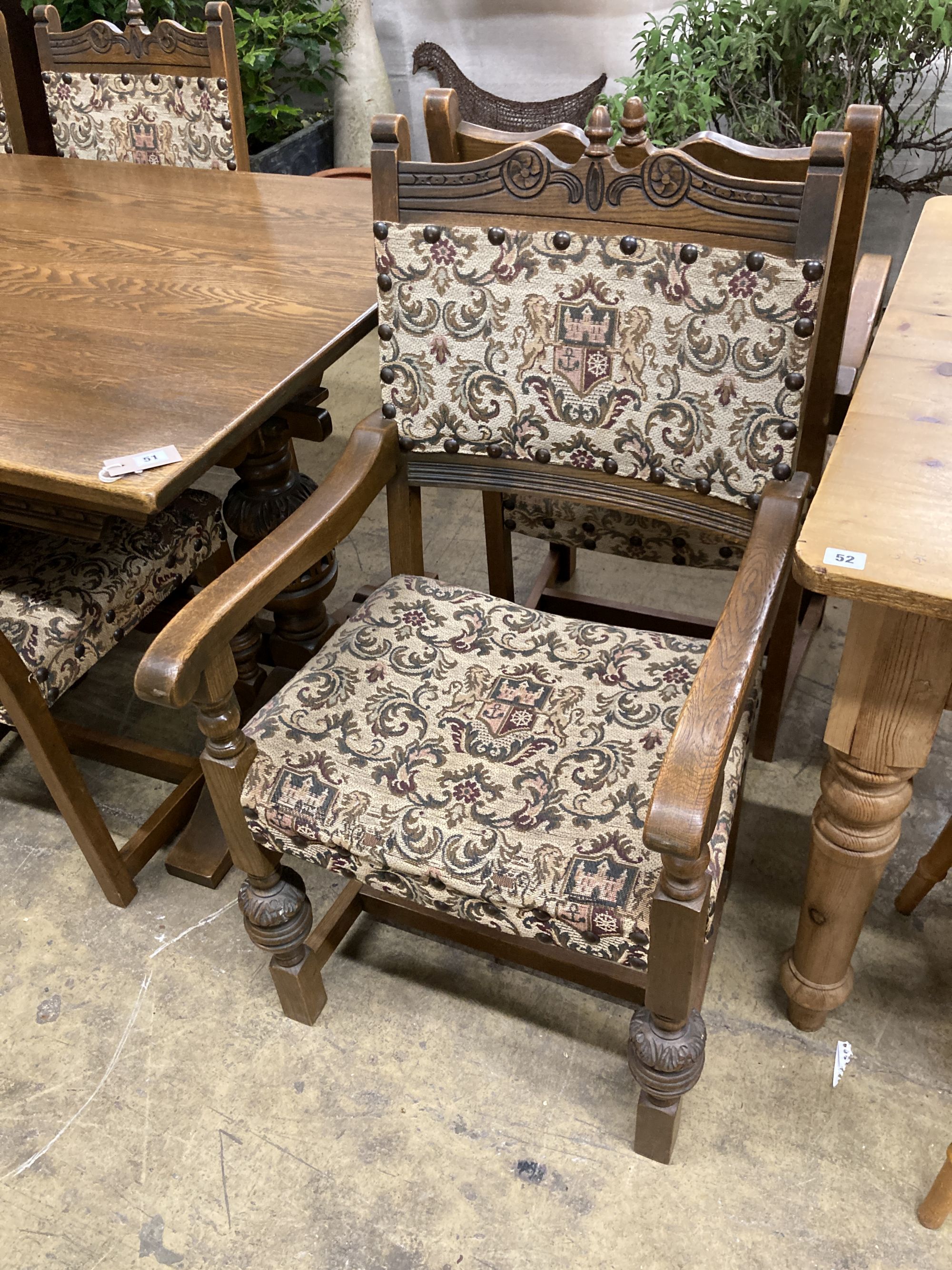 A rectangular 18th century style oak refectory dining table, length 182cm, depth 91cm, height 78cm, together with six matching dining chairs (two with arms)